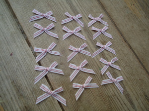 Red and white trimming ribbon bows, 15 in a pack, dressmaking supplies and online haberdashery, pretty ribbon bows for sale, trimmings and accesories for sewing online shop at HandBound Costume Supplies