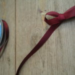 Maroon red ribbon - Online Ribbon stockists, Spiral ribbon brand - col.30, historical costume trims and supplies, Period Clothing accesories, HandBound Historical Costumes supplies, Online fabric and ribbon shop