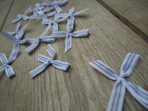 Blue and white trimming ribbon bows, 15 in a pack, dressmaking supplies and online haberdashery, pretty ribbon bows for sale, trimmings and accesories for sewing online shop at HandBound Costume Supplies
