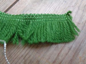 wool effect green short tassle, where can i get a rnage of tassle for sale, I need a tassle for a project I'm sewing i need an online haby, costume department shopping haby and trims