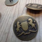 horse and shield coats of arms on brass button, online button shop, replica buttons for period costume,
